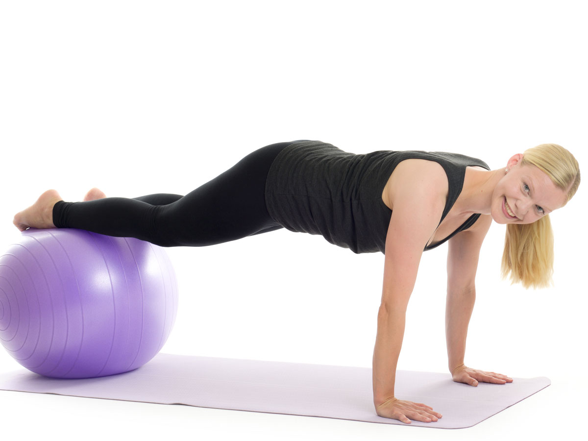 plank pose feet on ball
